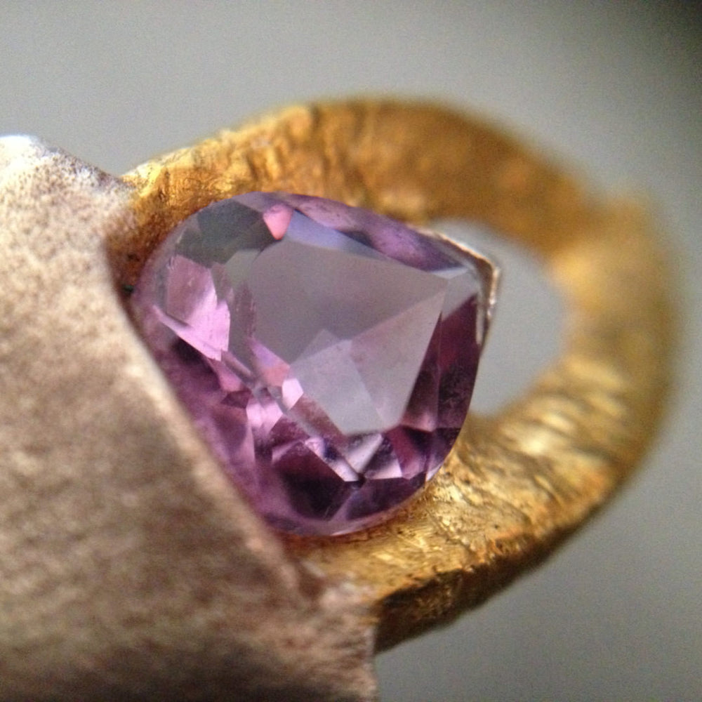 Azulie Sepulchre Collection, fine silver, 22kt gold and faceted amethyst handmade cicada ring, closeup of gemstone