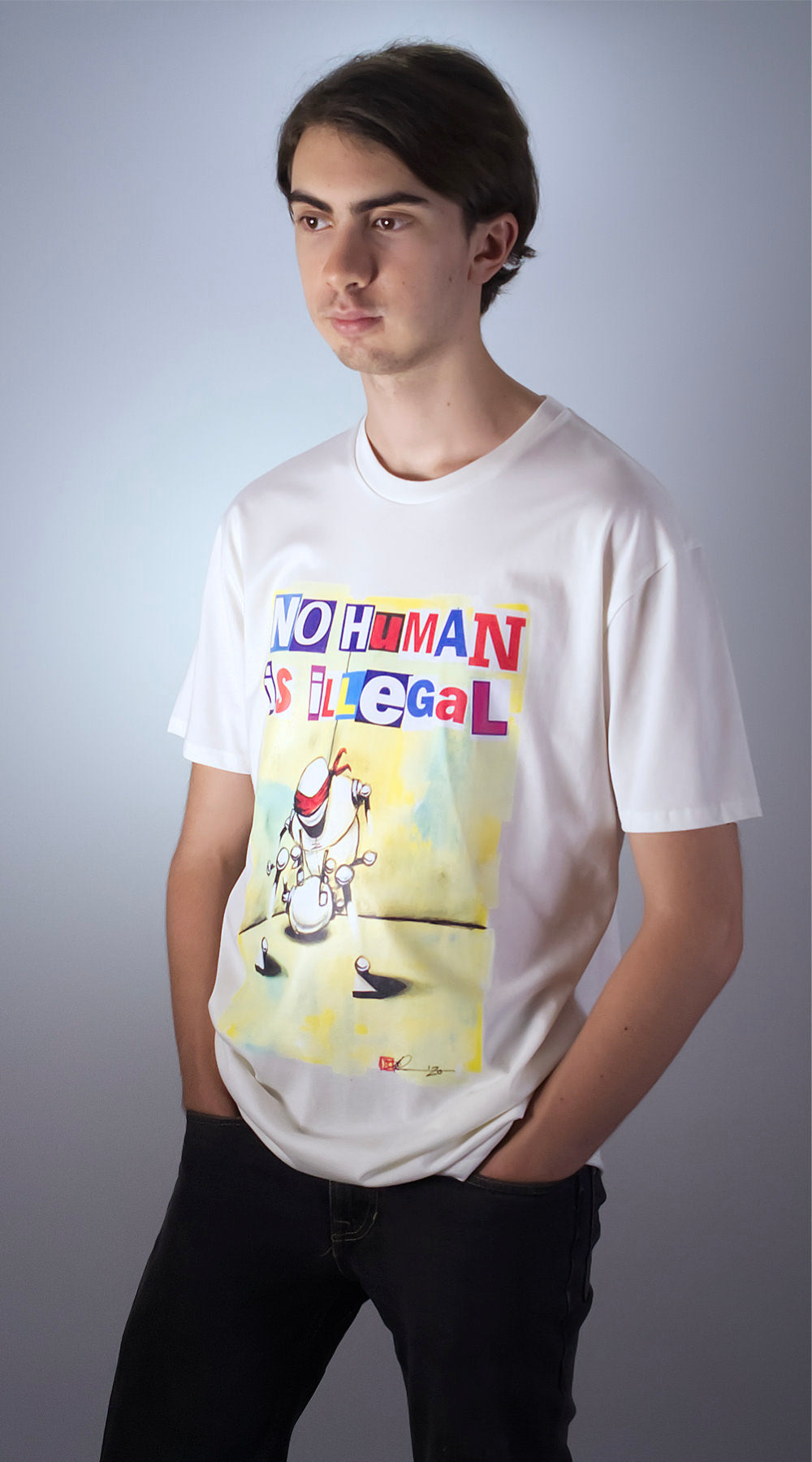 Men's natural Art-Shirt, design by Cyrano Denn 'No Human is Illegal' GOTS certified organic cotton front view
